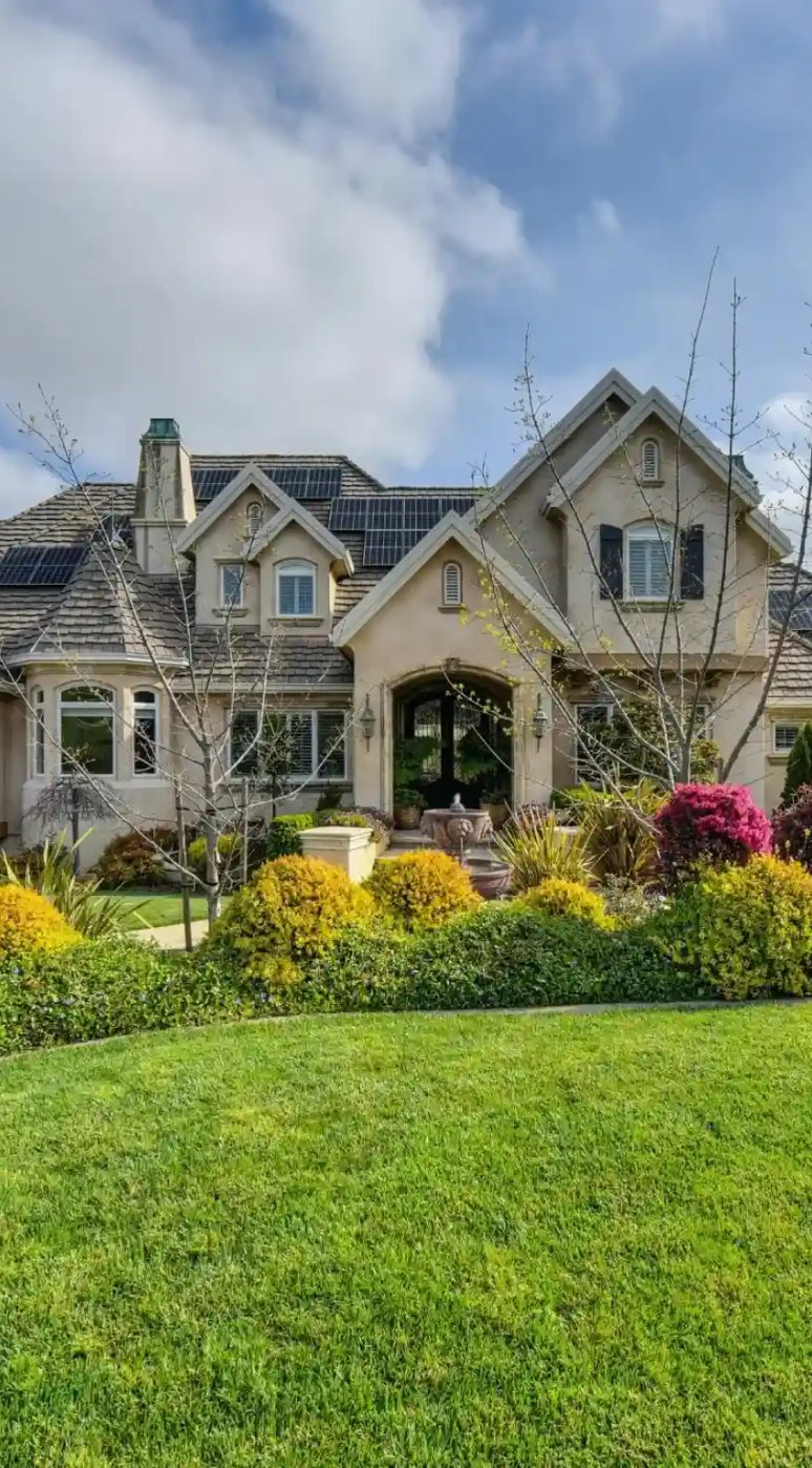 Photo of the front of a house with a beautiful landscape